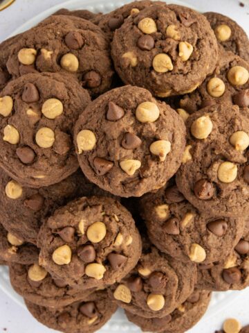 Overhead view of a plate piled high with Chocolate Peanut Butter Cookies.