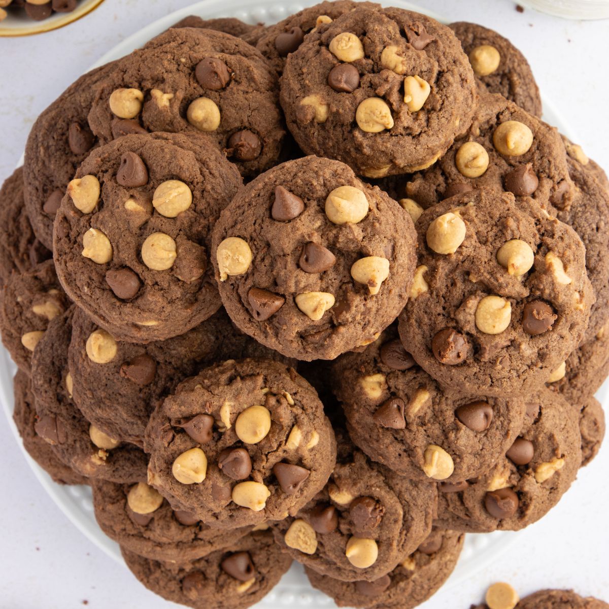 Overhead view of a plate piled high with Chocolate Peanut Butter Cookies.