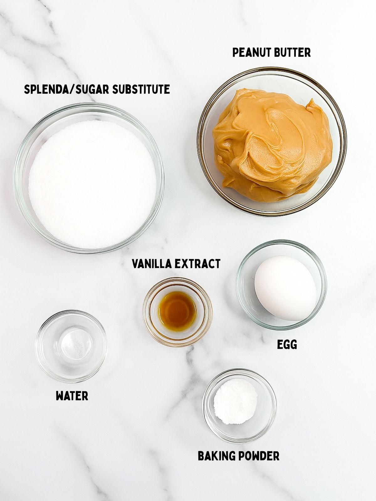 Ingredients in clear bowls for peanut butter cookies made with sugar substitute.