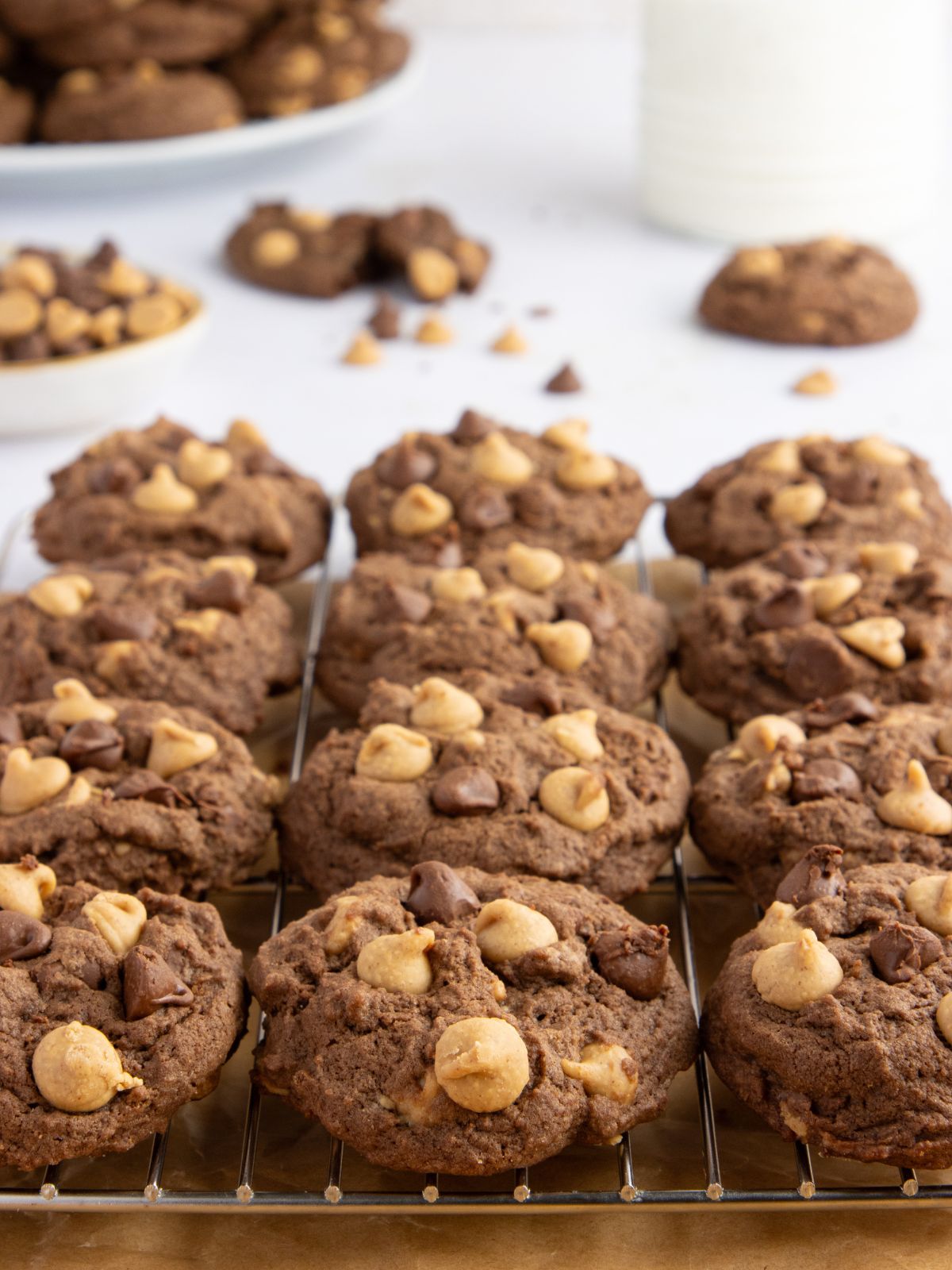 Chocolate peanut butter cookies on a cooling rack.