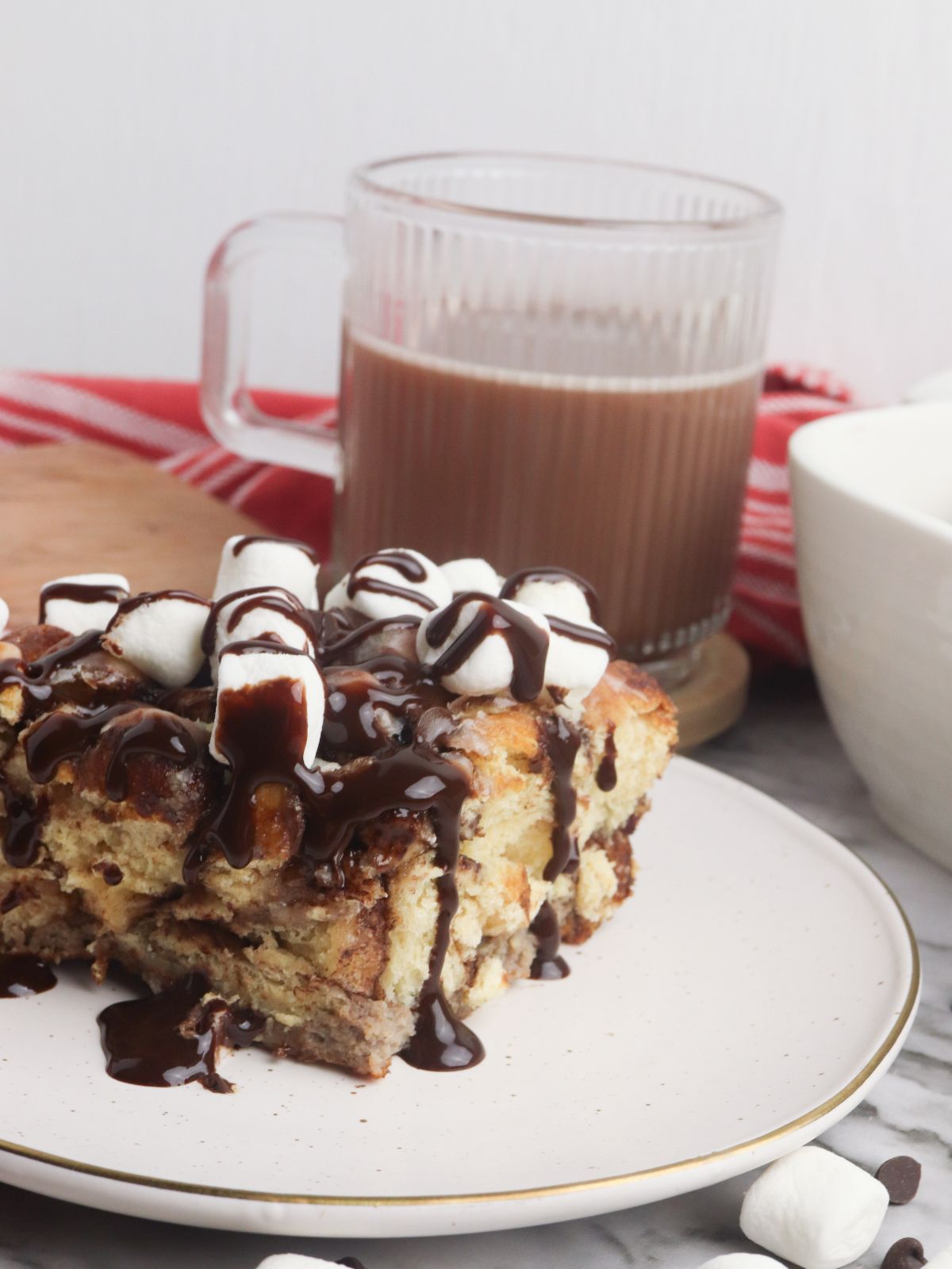 French toast casserole made with cinnamon rolls and hot cocoa mix on plate.