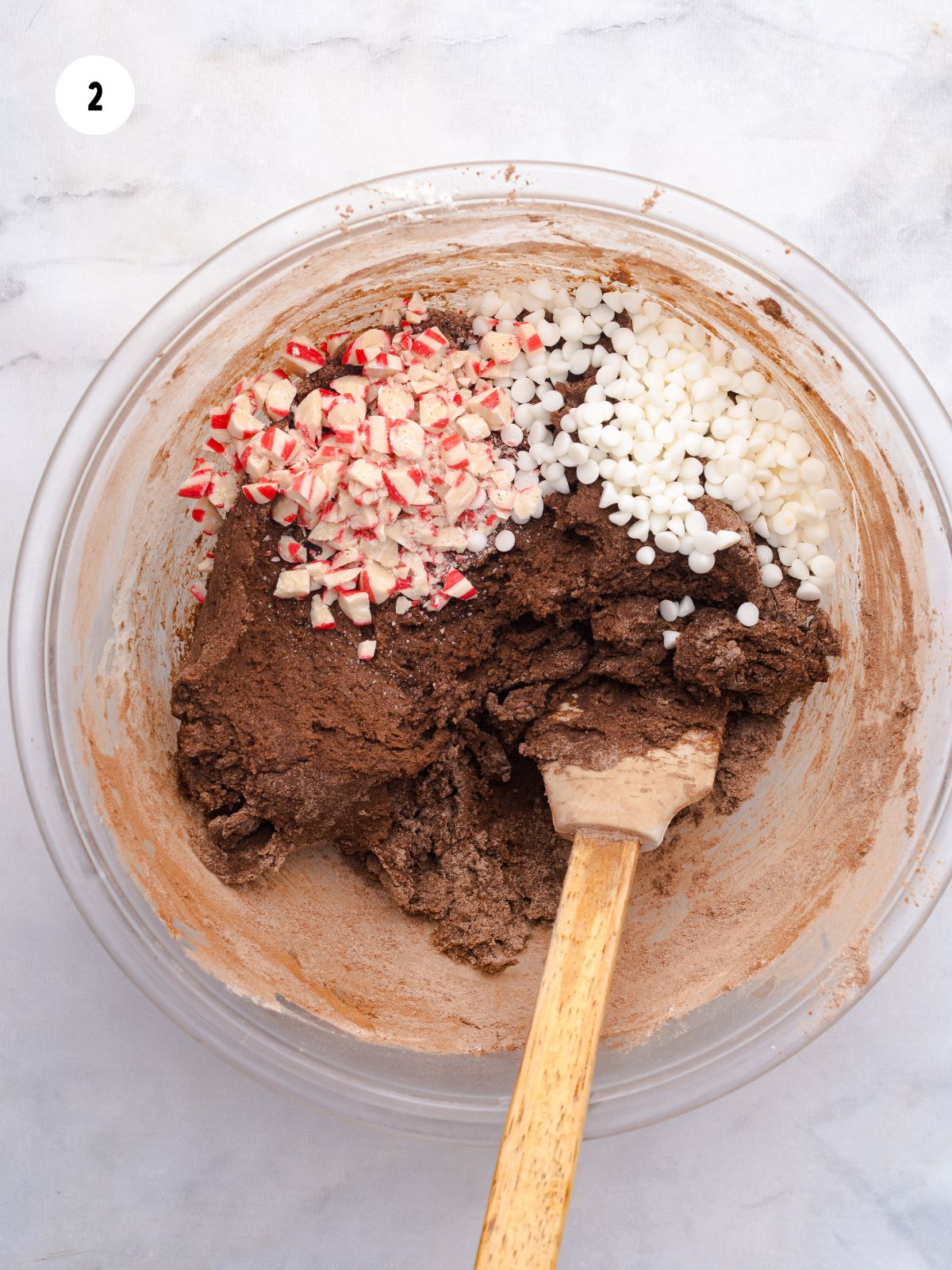 crushed peppermints and mini white chocolate chips added to chocolate cookie batter.