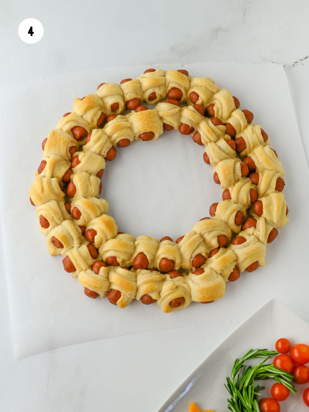 baked pig in a blanket wreath.