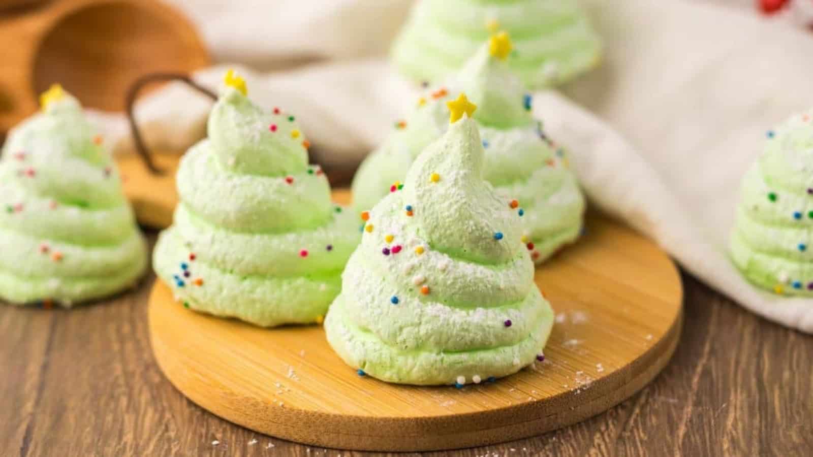 Christmas tree meringues piped into tree shapes with green coloring.