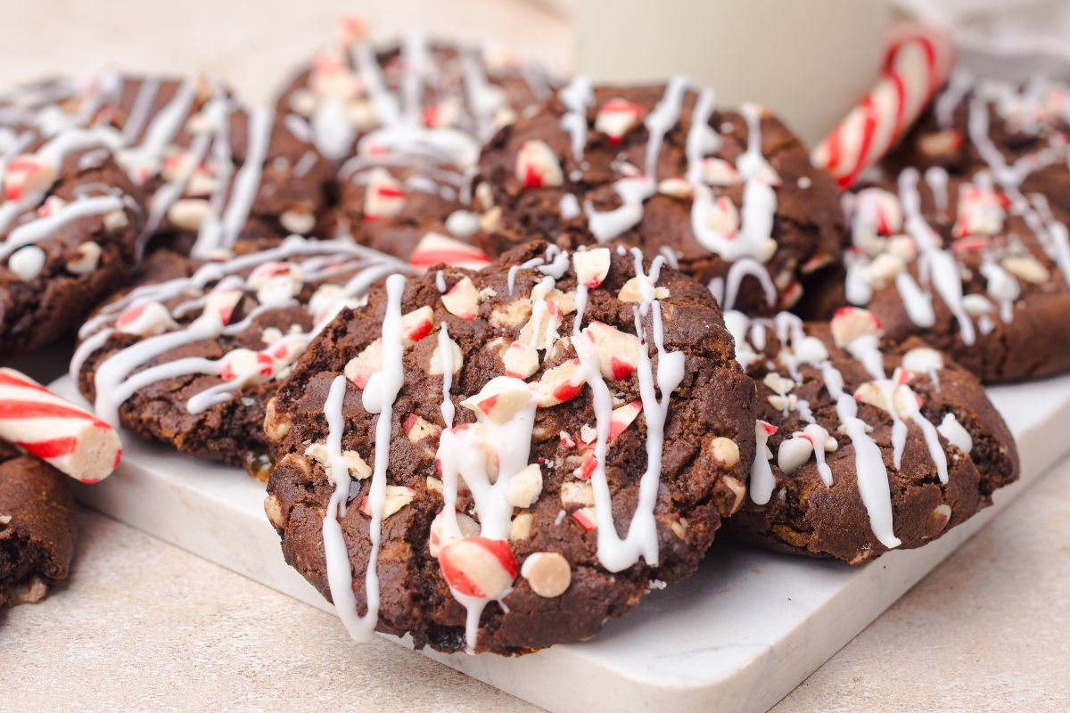 Chocolate cookies filled with mini white chocolate chips and crushed peppermints, then drizzled with melted white chocolate.