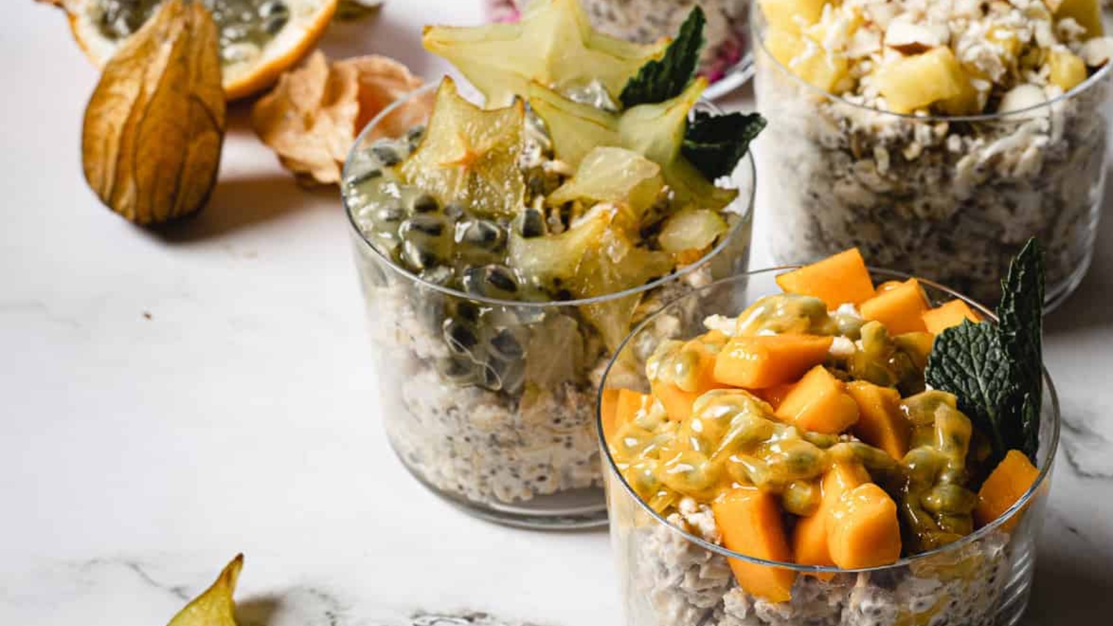 Four combinations of vegan overnight oats with fruit.