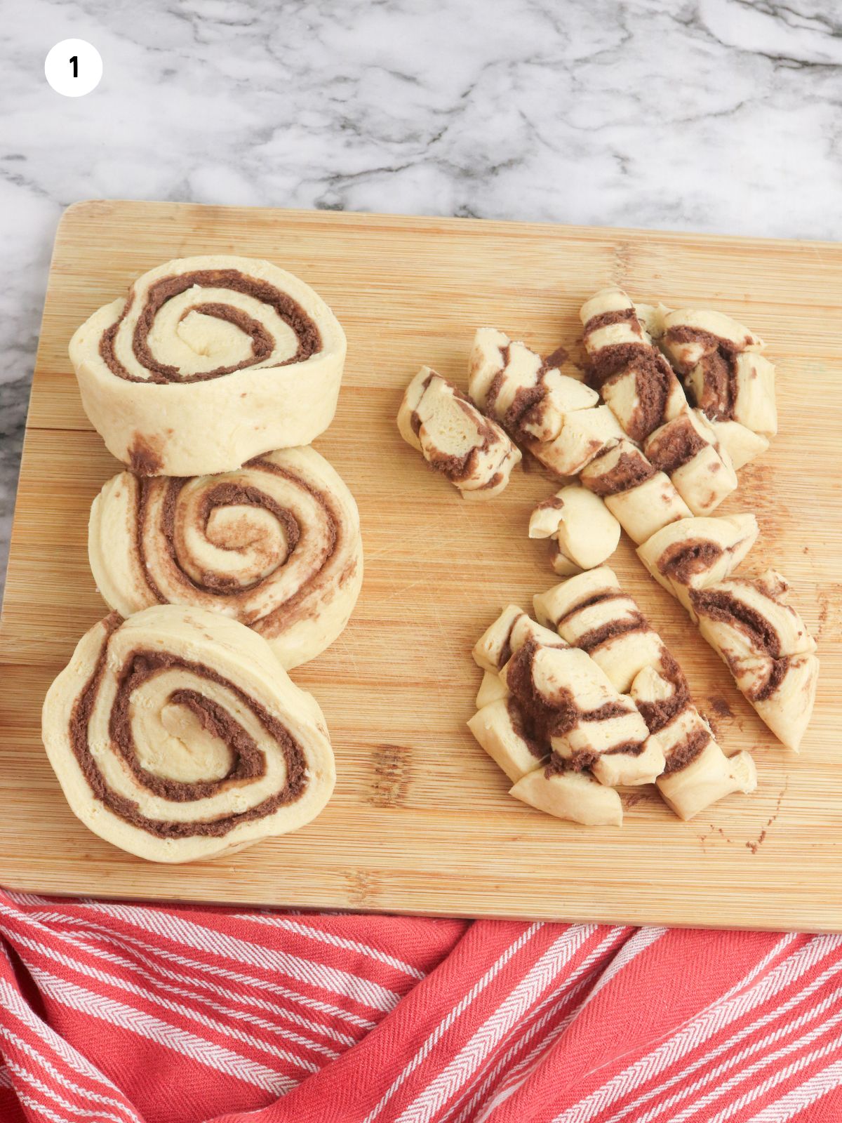 Pillsbury cinnamon rolls on cutting board.