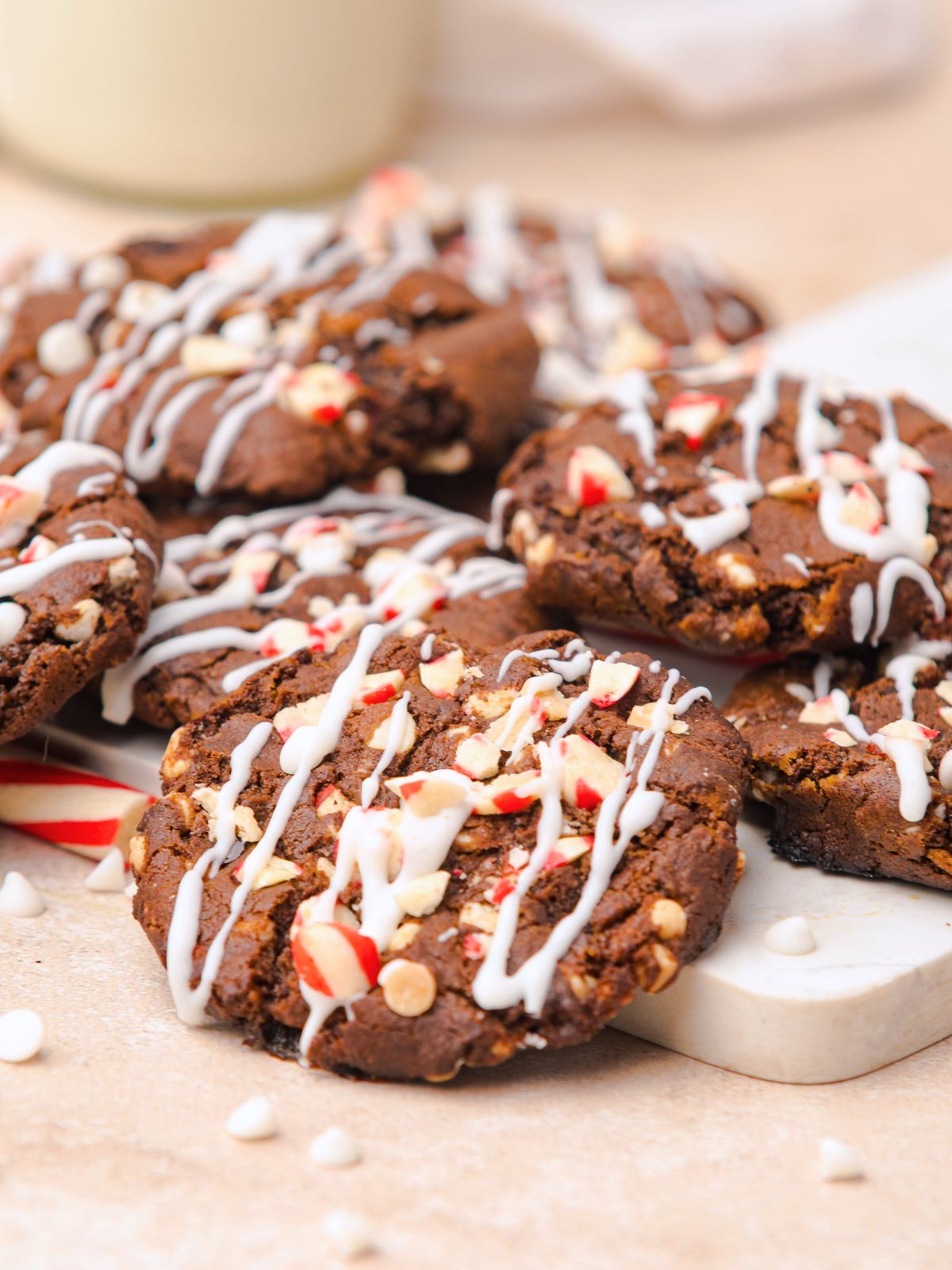 Pile of Easy Chocolate Peppermint Cookies with white chocolate drizzle.