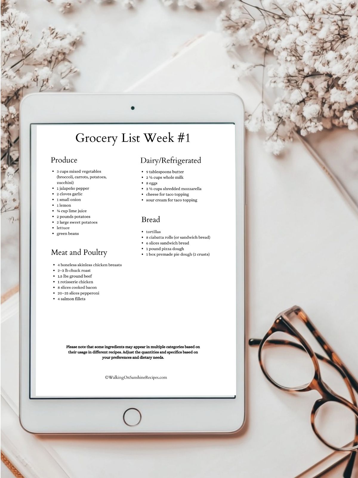 grocery list in tablet with pair of glasses on table.