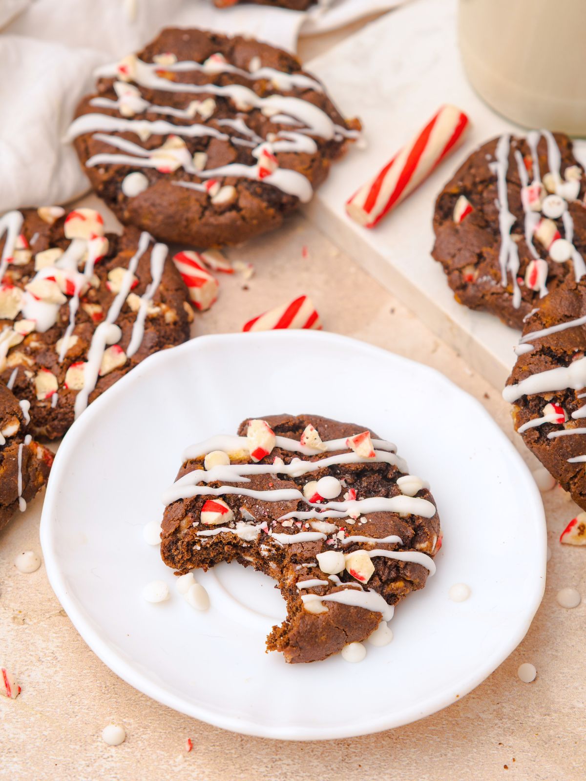 Chocolate Peppermint Cookie with a bite taken out on a small white plate.