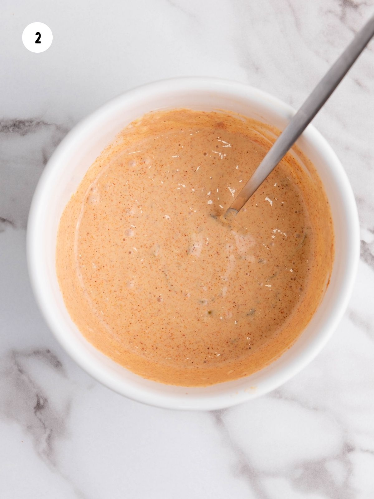 Burger sauce in a white ramekin.