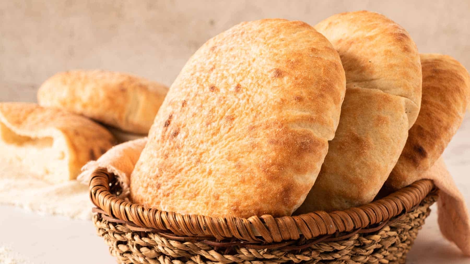 Pita breads in a basket.