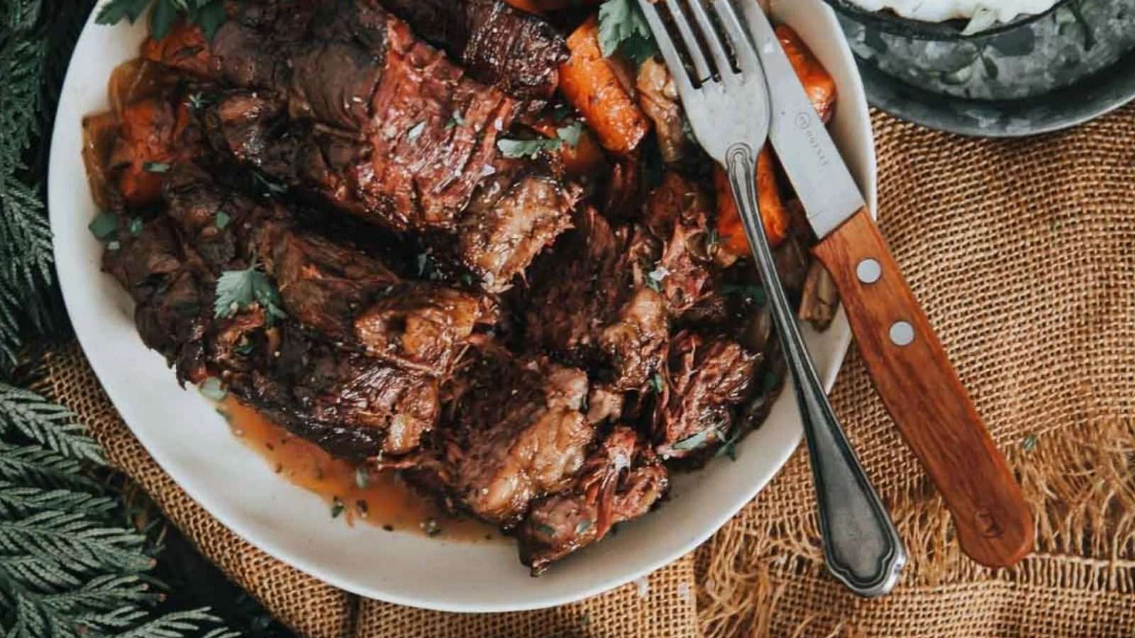 Slow cooker pot roast with falling-apart beef and vegetables in savory broth.