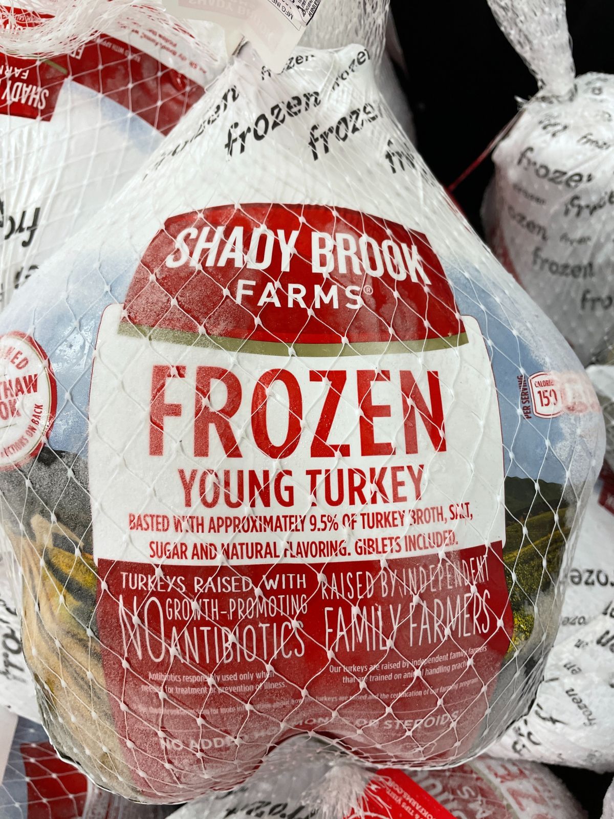 Frozen turkey in a store freezer ready for purchase.