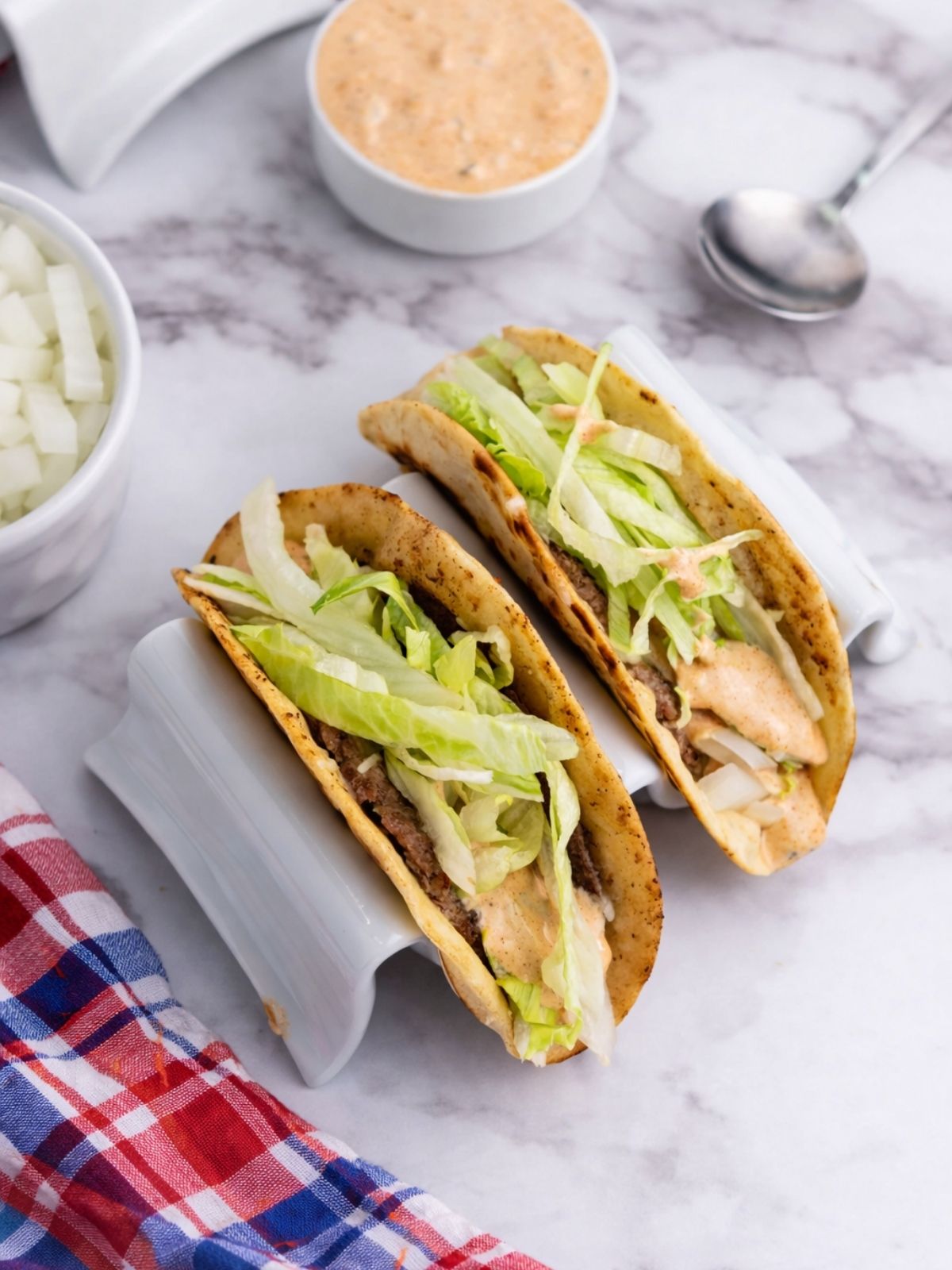 Overhead view of tacos in a taco stand.