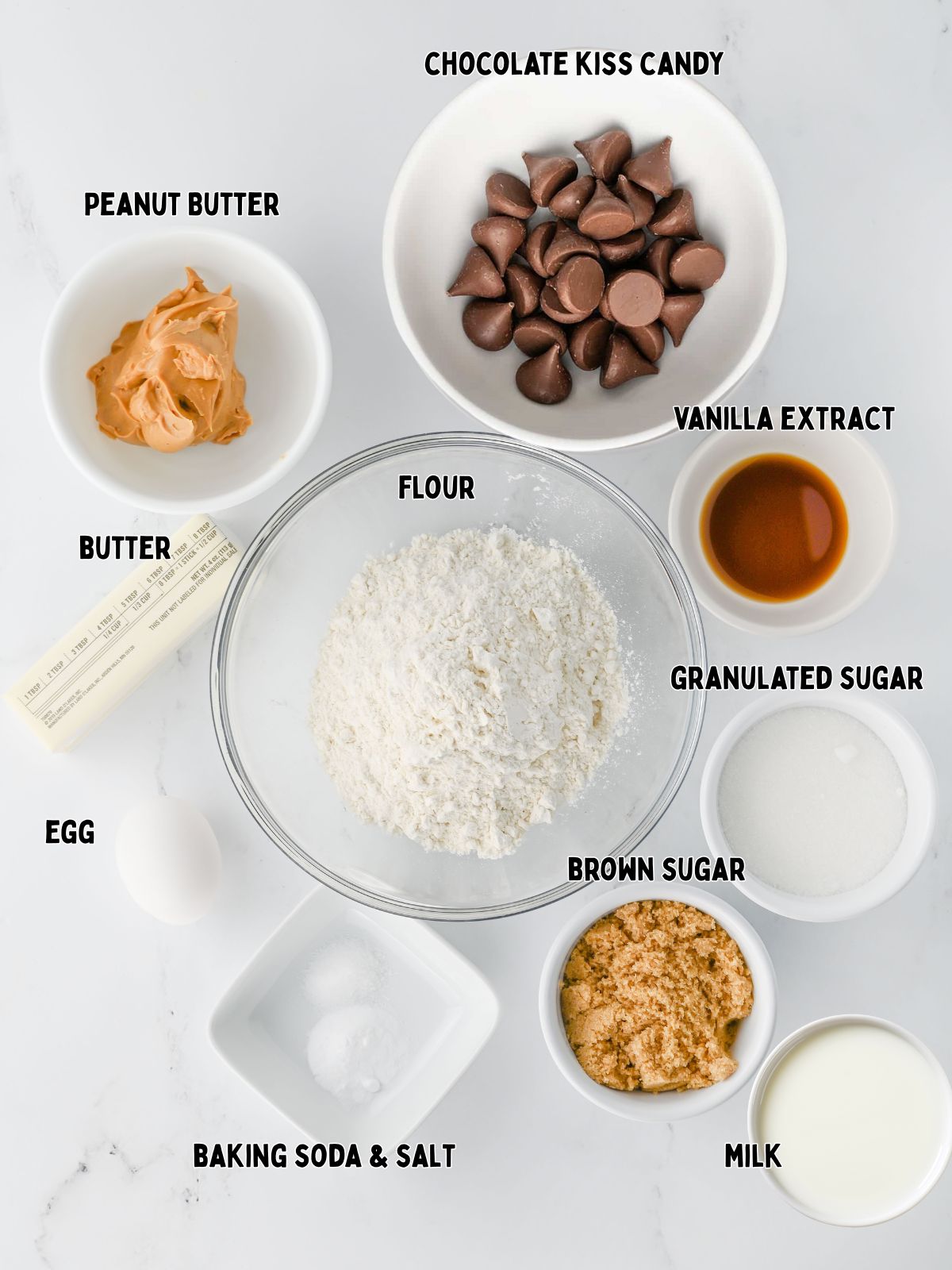 bowls of ingredients for peanut butter blossom cookies.
