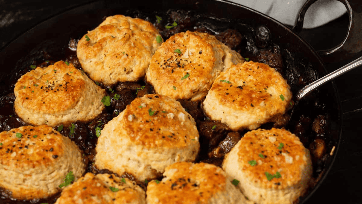 Hearty beef stew made with Guinness stout and vegetables, topped with a pastry crust and baked until golden.