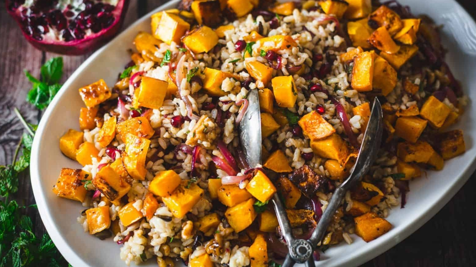 Side view of wild rice pilaf with pomegranate and butternut squash.