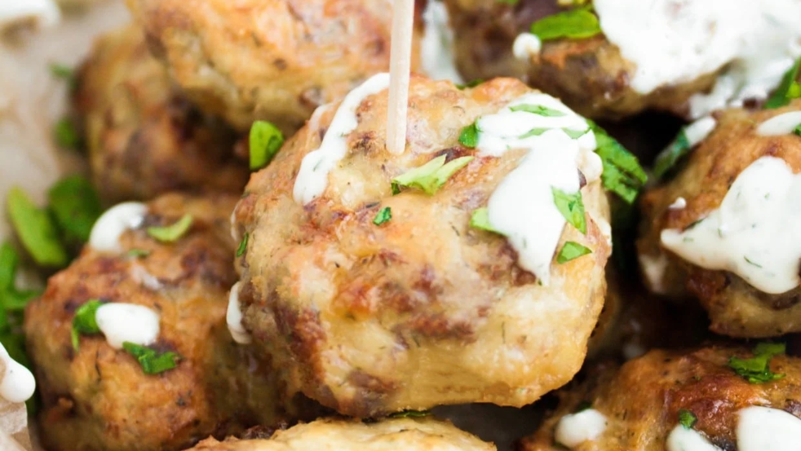 A chicken bacon ranch popper skewered by a toothpick.