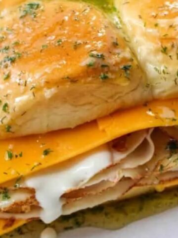 A tray of ham and cheese sliders.