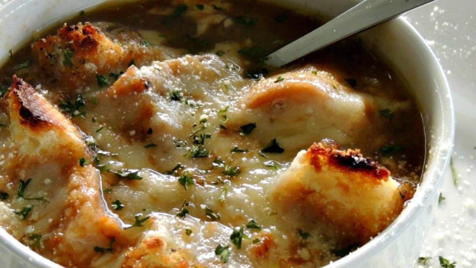 Easy French onion soup with video served in a bowl