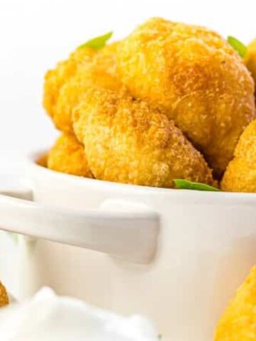 Crispy tater tots croquettes in a bowl.