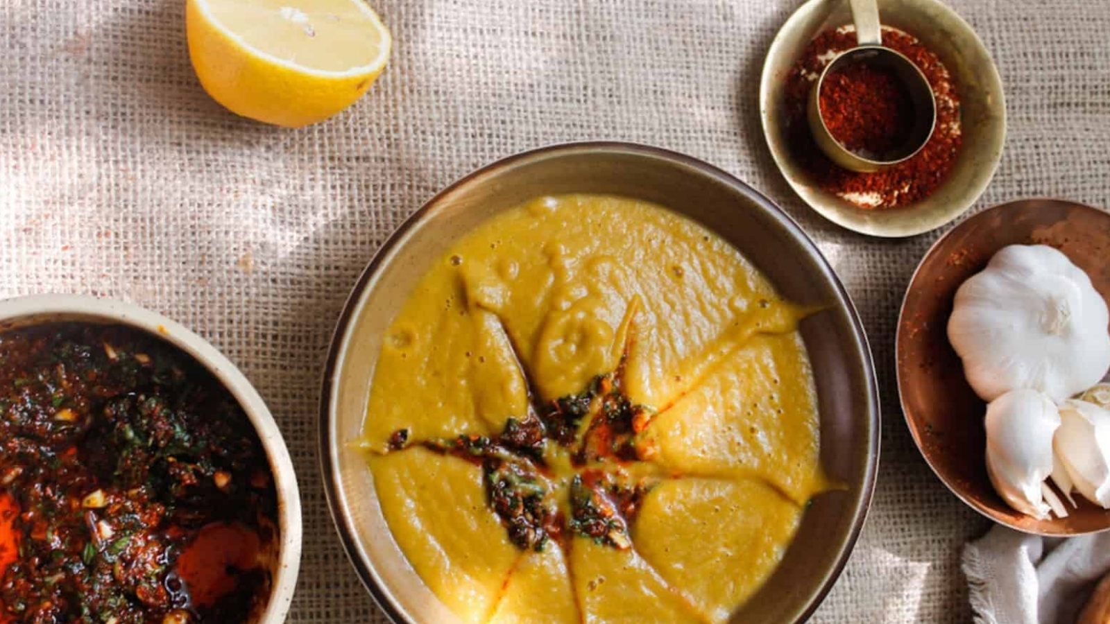 Two bowls of soup on a table.