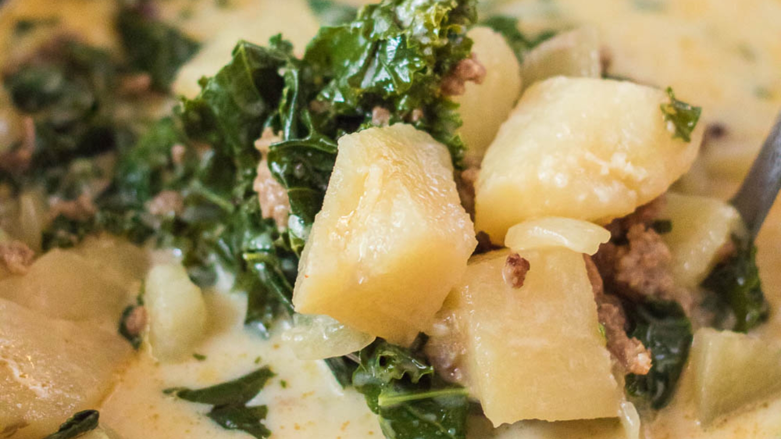 A Slow Cooker Zuppa Toscana with potatoes and kale.