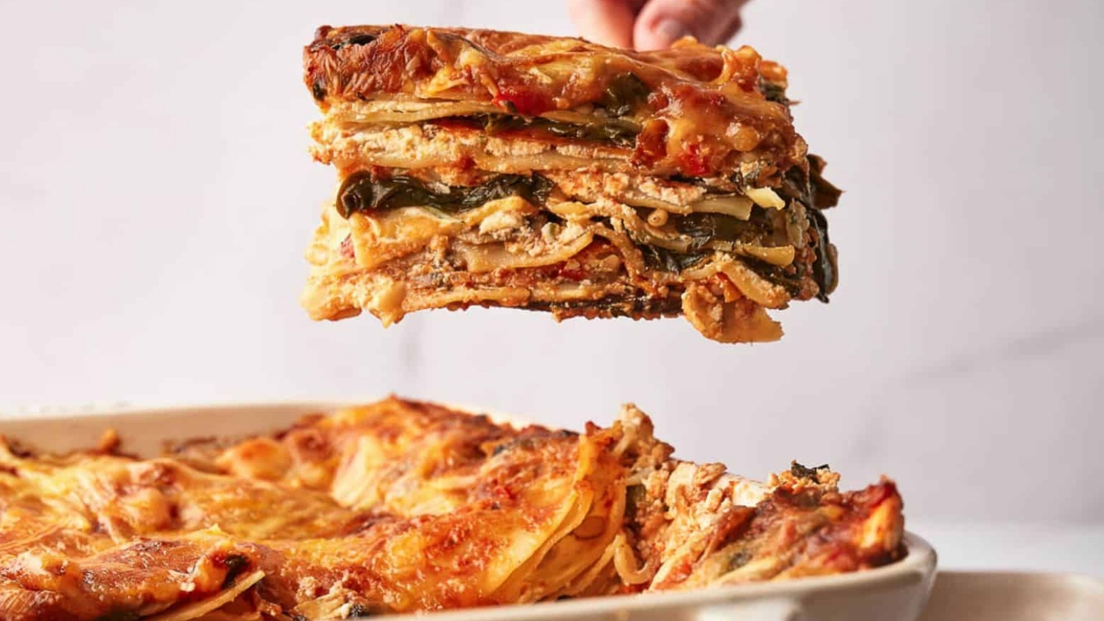 A lasagna being dished up.