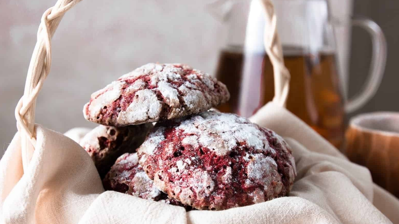 A stack of Valentine red velvet cookies with in a basket.