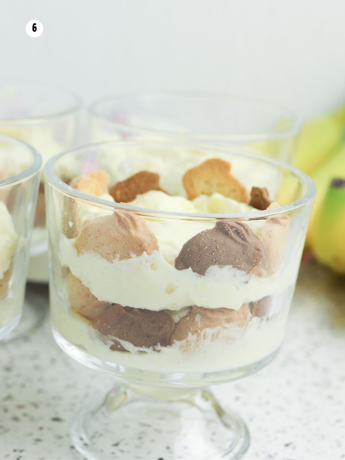 add another layer of cookies and pudding in the glass dessert cups.