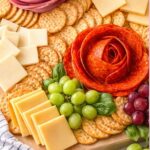 cheese, fruit, crackers snack board with meat roses.