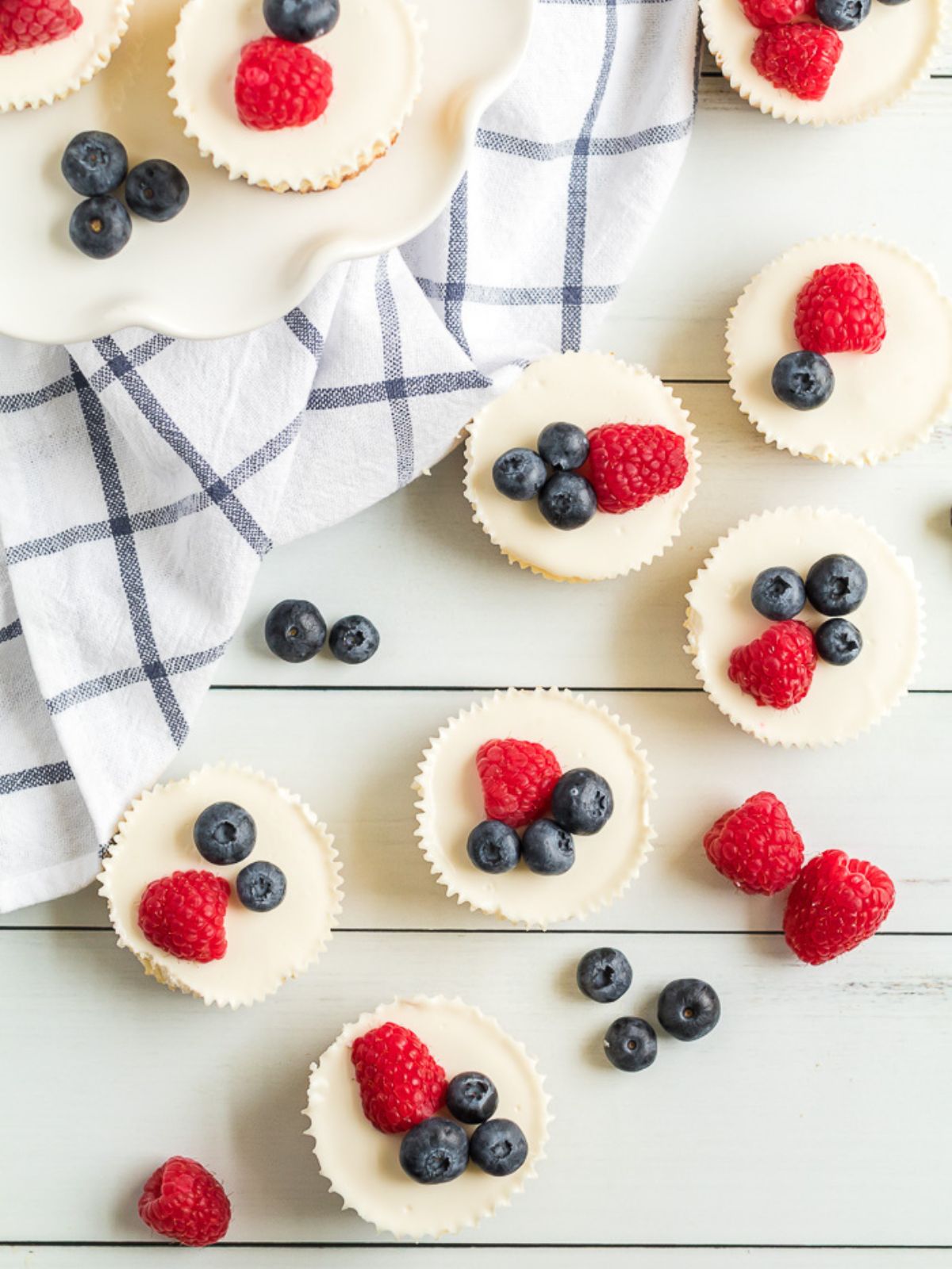 mini cheesecakes with fresh fruit served.