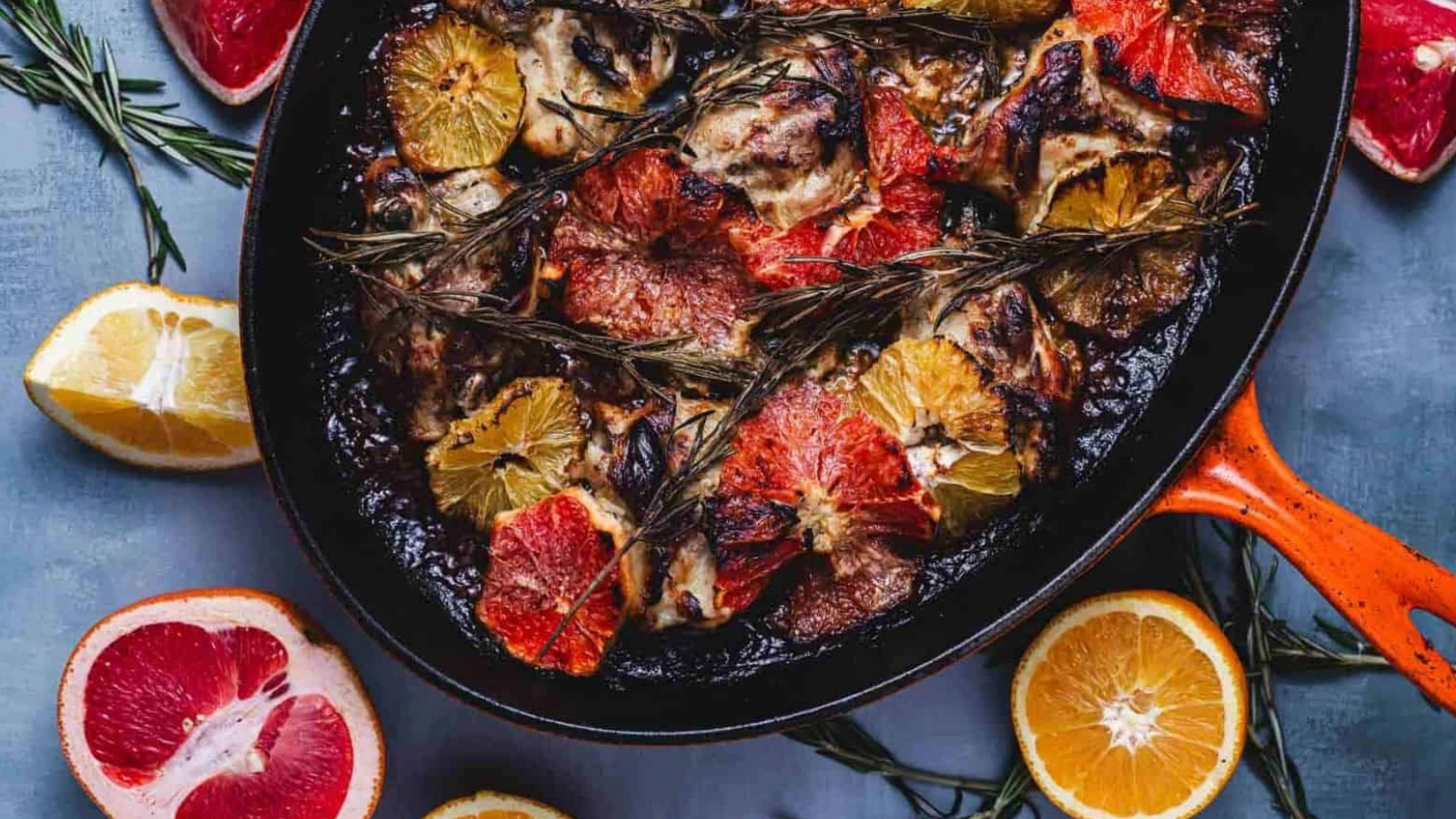 A creamy citrus‑rosemary chicken thigh on a white plate.