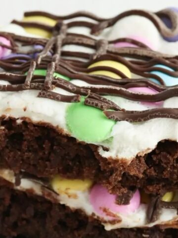 Easter brownies with colorful pastel decorations on a plate.