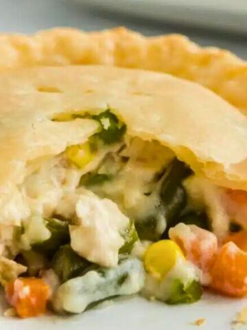 Homemade Chicken Pot Pie: Baked pie filled with creamy chicken and vegetables under a pastry crust.