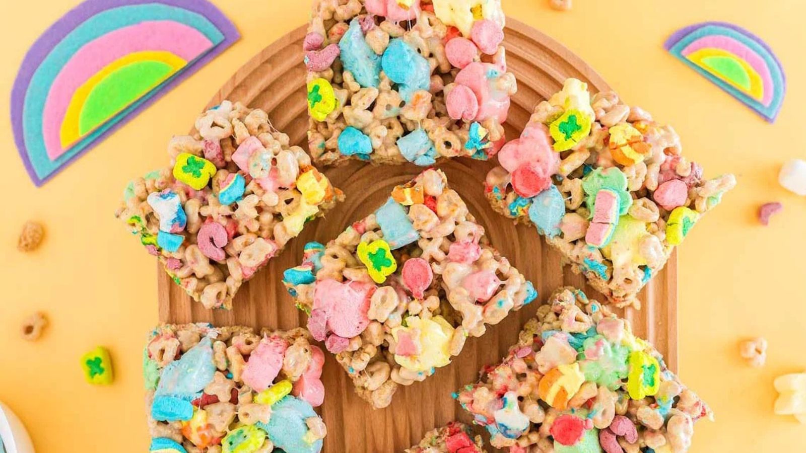 Rice Krispie treat squares topped with green and white sprinkles.