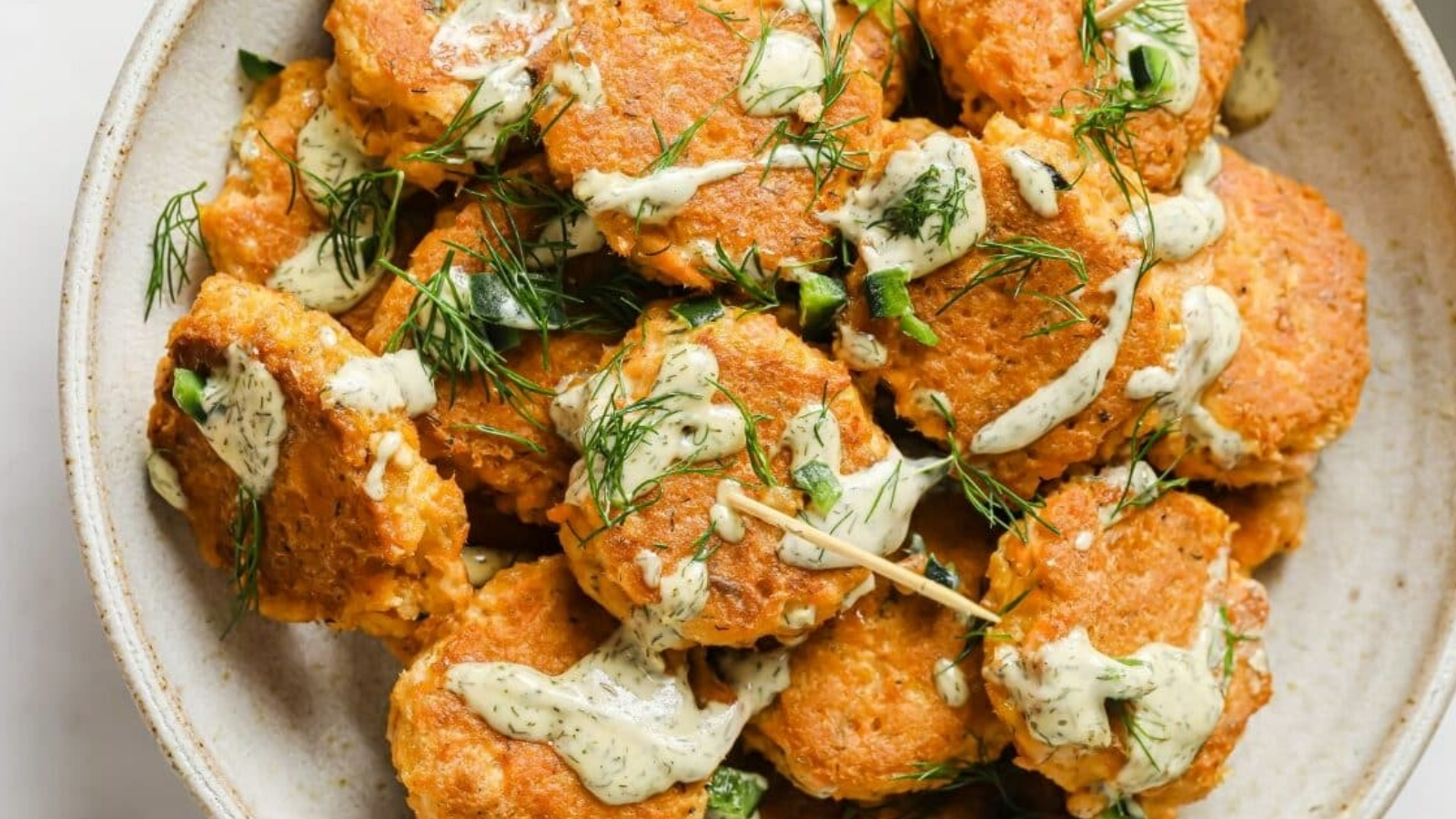 Mini spicy canned salmon patties in a serving bowl.