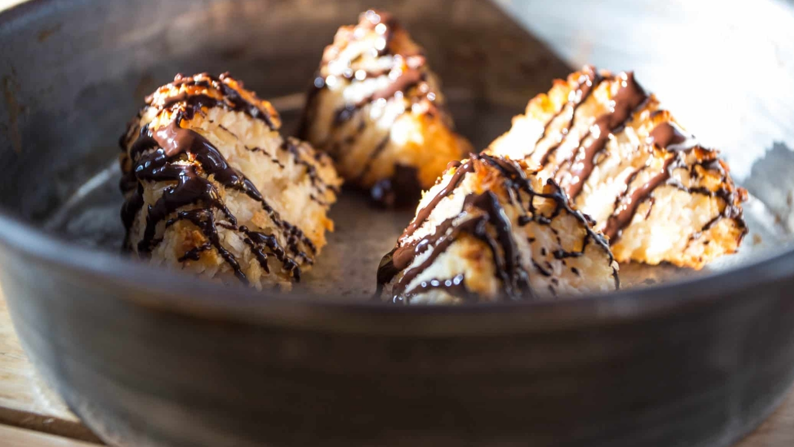 4 Coconut macaroons on baking dish.