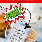 Free s’mores printable gift tags attached to treat bags with graham crackers, chocolate, and marshmallows for party favors.