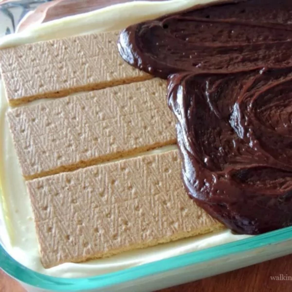 Homemade chocolate ganache spread over graham crackers and vanilla pudding for chocolate eclair pie.