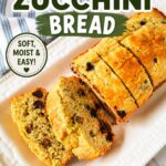 Bisquick zucchini bread Pinterest pin featuring sliced zucchini bread with chocolate chips and walnuts on a white platter with recipe title overlay.
