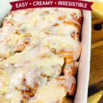 Egg-free cinnamon roll casserole made with refrigerated cinnamon rolls and a maple cream cheese filling, baked in a casserole dish and topped with sweet icing.